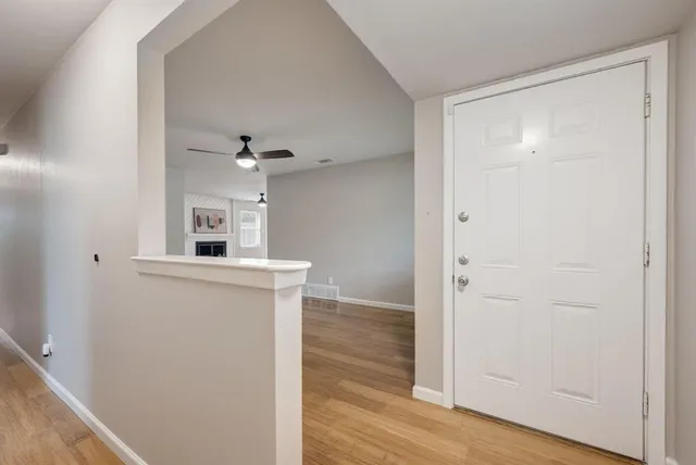 a view of a kitchen from the hallway