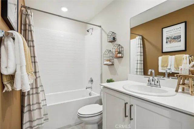 a bathroom with a sink a toilet and a bathtub
