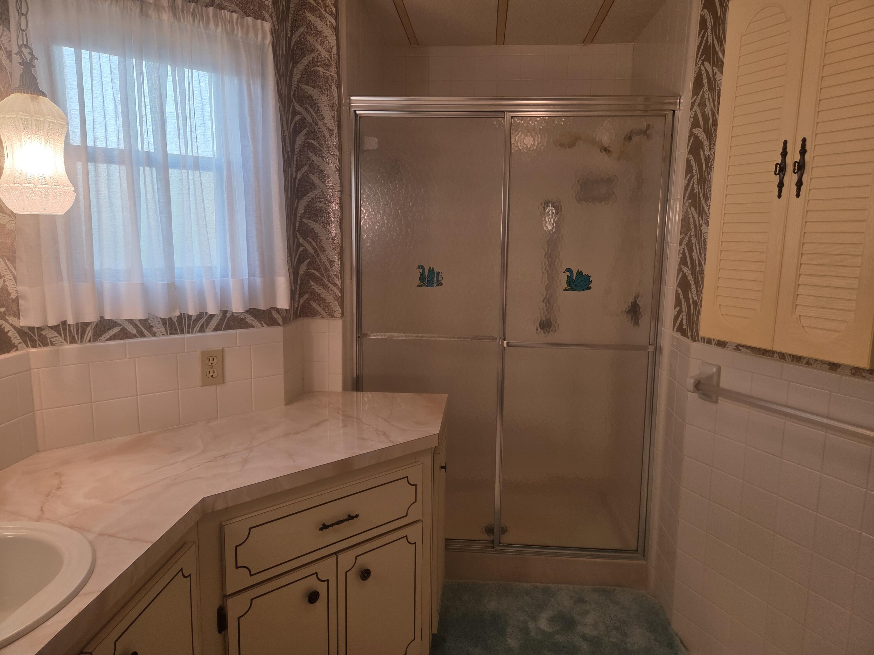 7107 Southeast Seahawk Street Hobe Sound, FL 33455 - Photo 20 of 22 primary bath 2