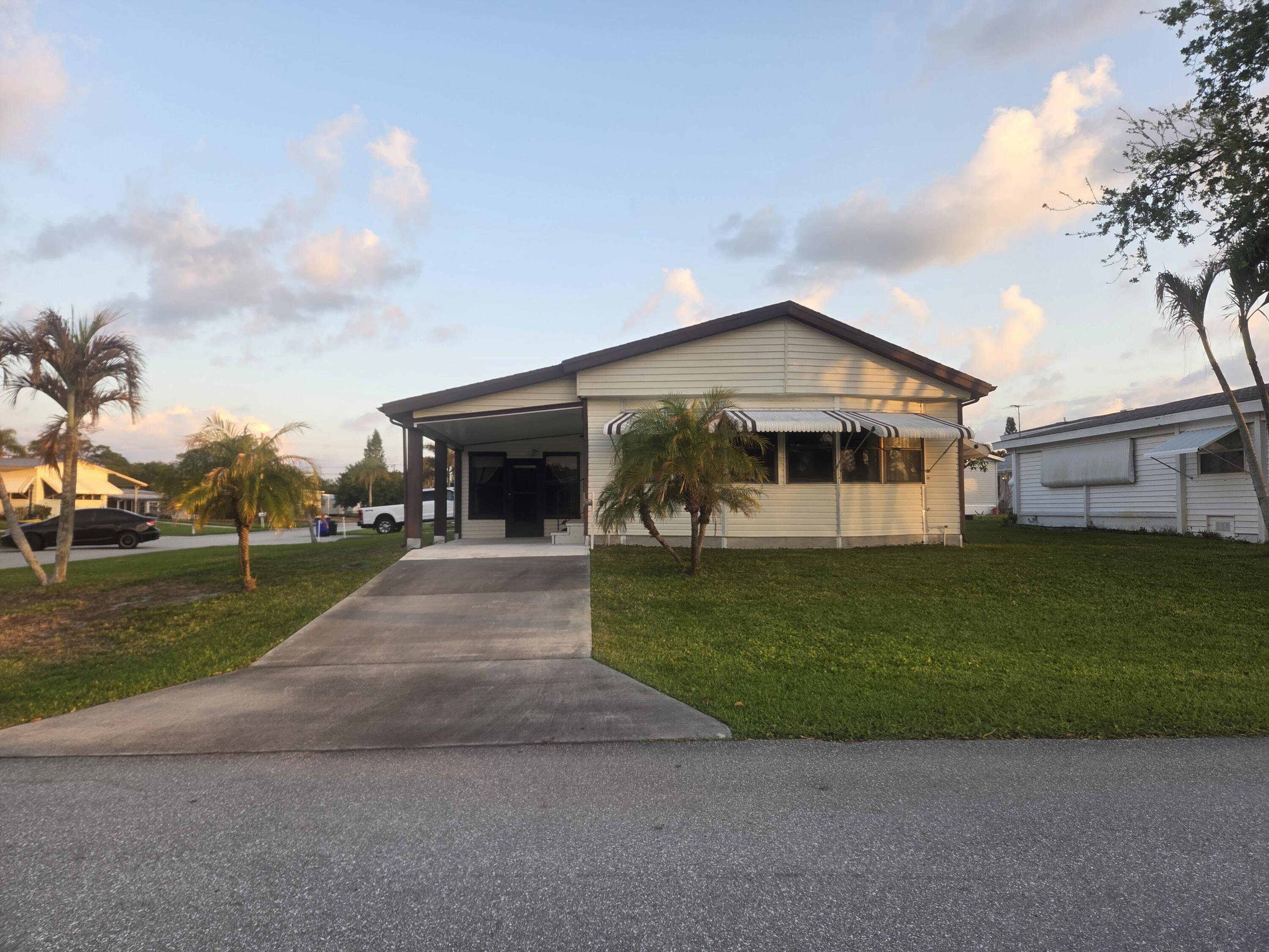 7107 Southeast Seahawk Street Hobe Sound, FL 33455 - Photo 2 of 22 front