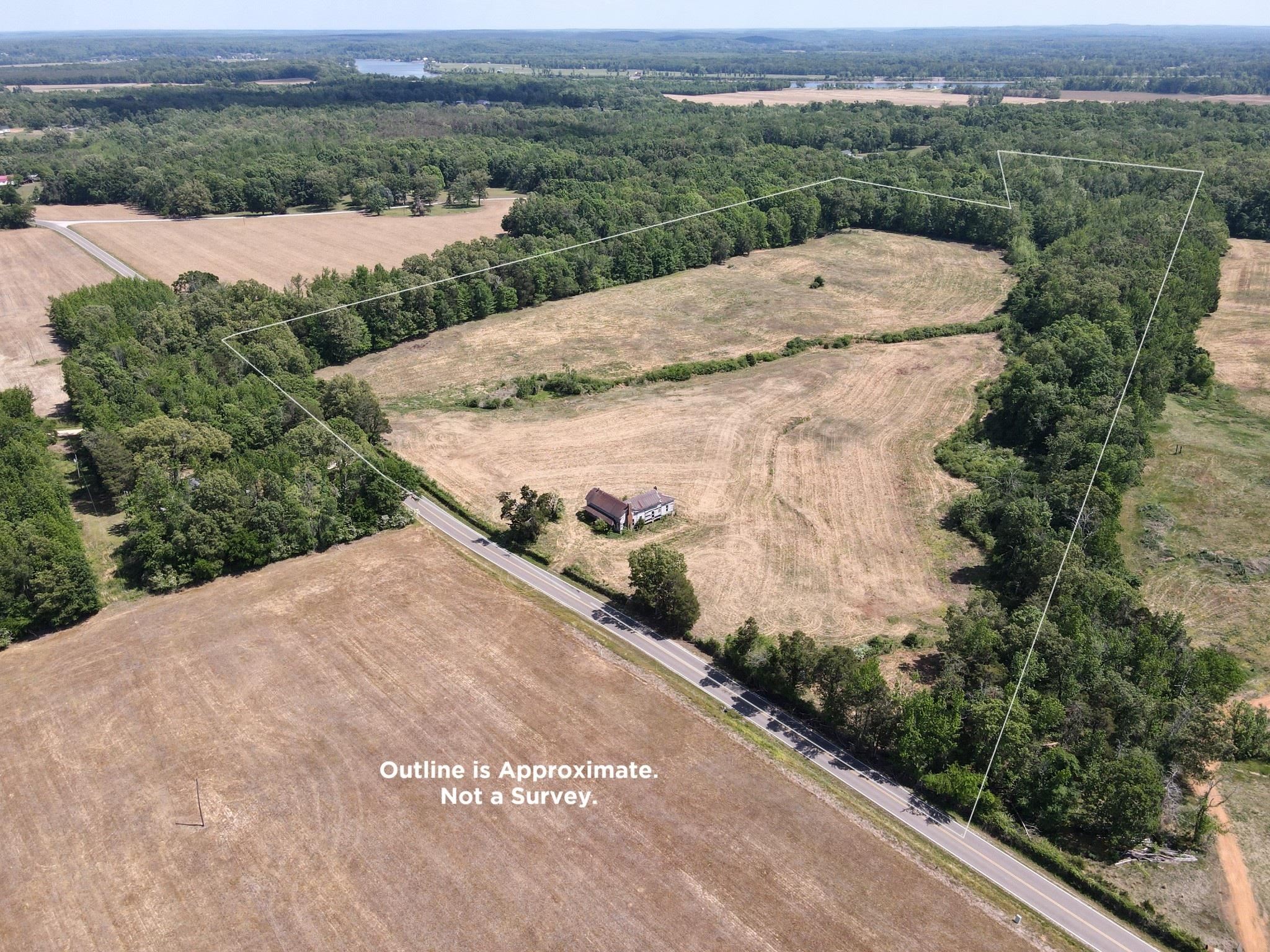 2 Saltillo Road Morris Chapel, TN 38361 - Photo 1 of 39 an aerial view of a house with a yard and lake view