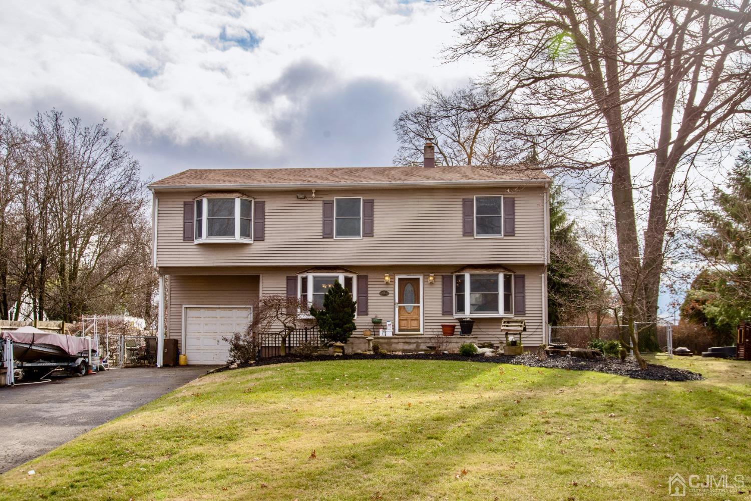 115 New Brooklyn Road Edison, NJ 08817 - Photo 1 of 53 a front view of a house with swimming pool and porch