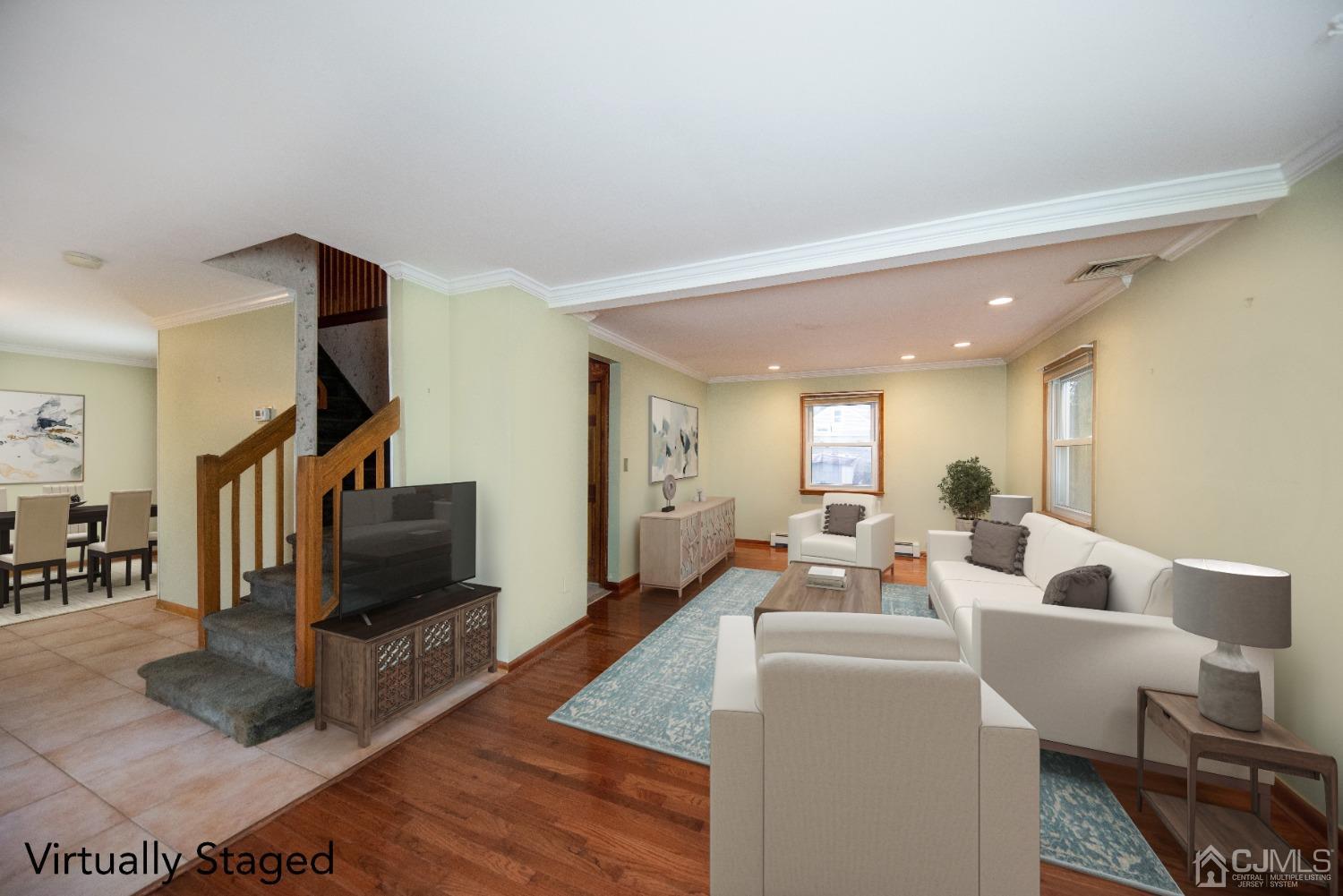 115 New Brooklyn Road Edison, NJ 08817 - Photo 21 of 53 a living room with furniture and a flat screen tv