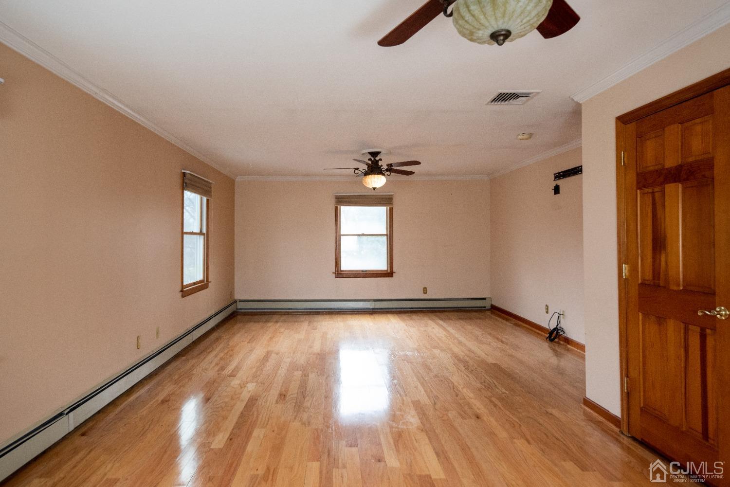 115 New Brooklyn Road Edison, NJ 08817 - Photo 25 of 53 wooden floor in an empty room with a window