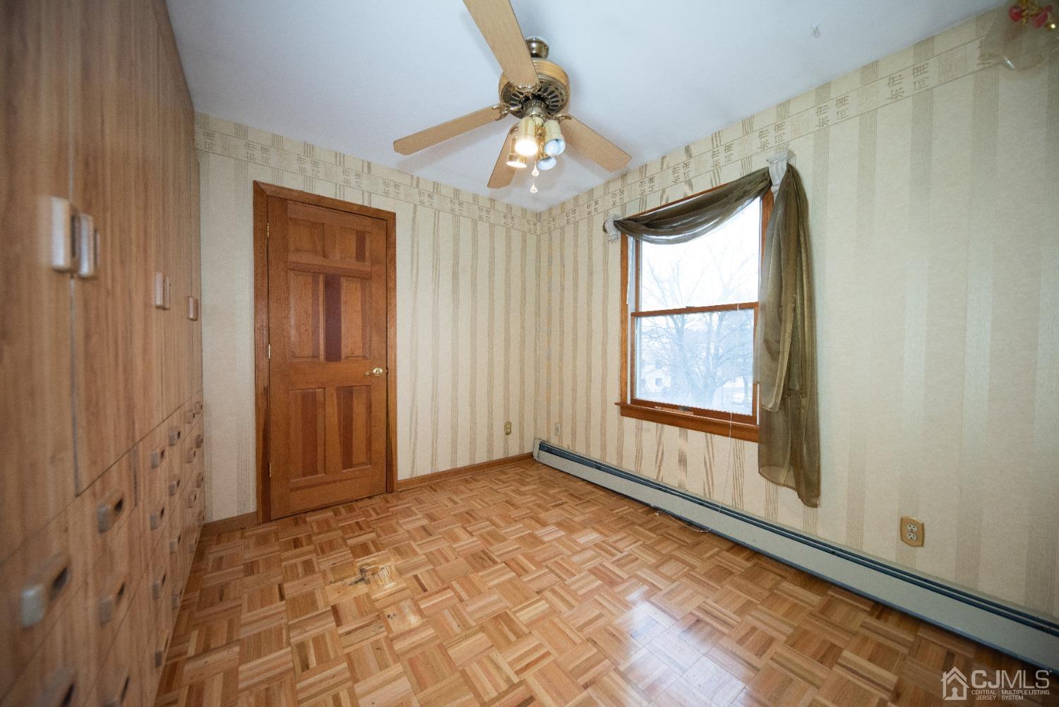 115 New Brooklyn Road Edison, NJ 08817 - Photo 34 of 53 an empty room with chandelier fan and windows