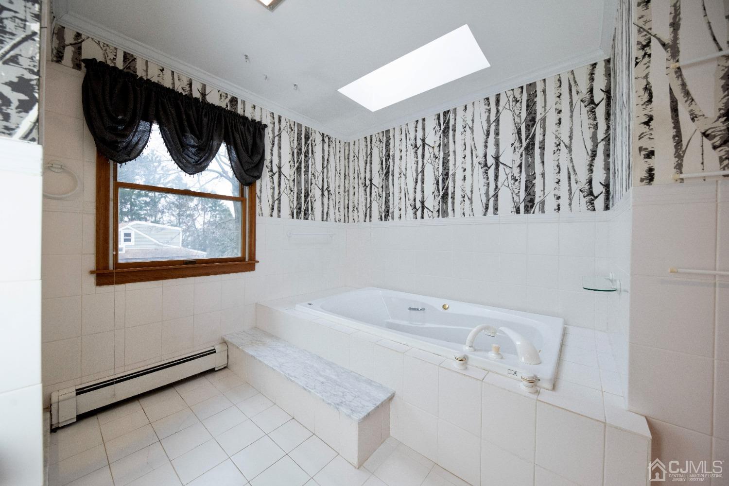 115 New Brooklyn Road Edison, NJ 08817 - Photo 35 of 53 a bathroom with a bathtub a shower a toilet and a bathtub