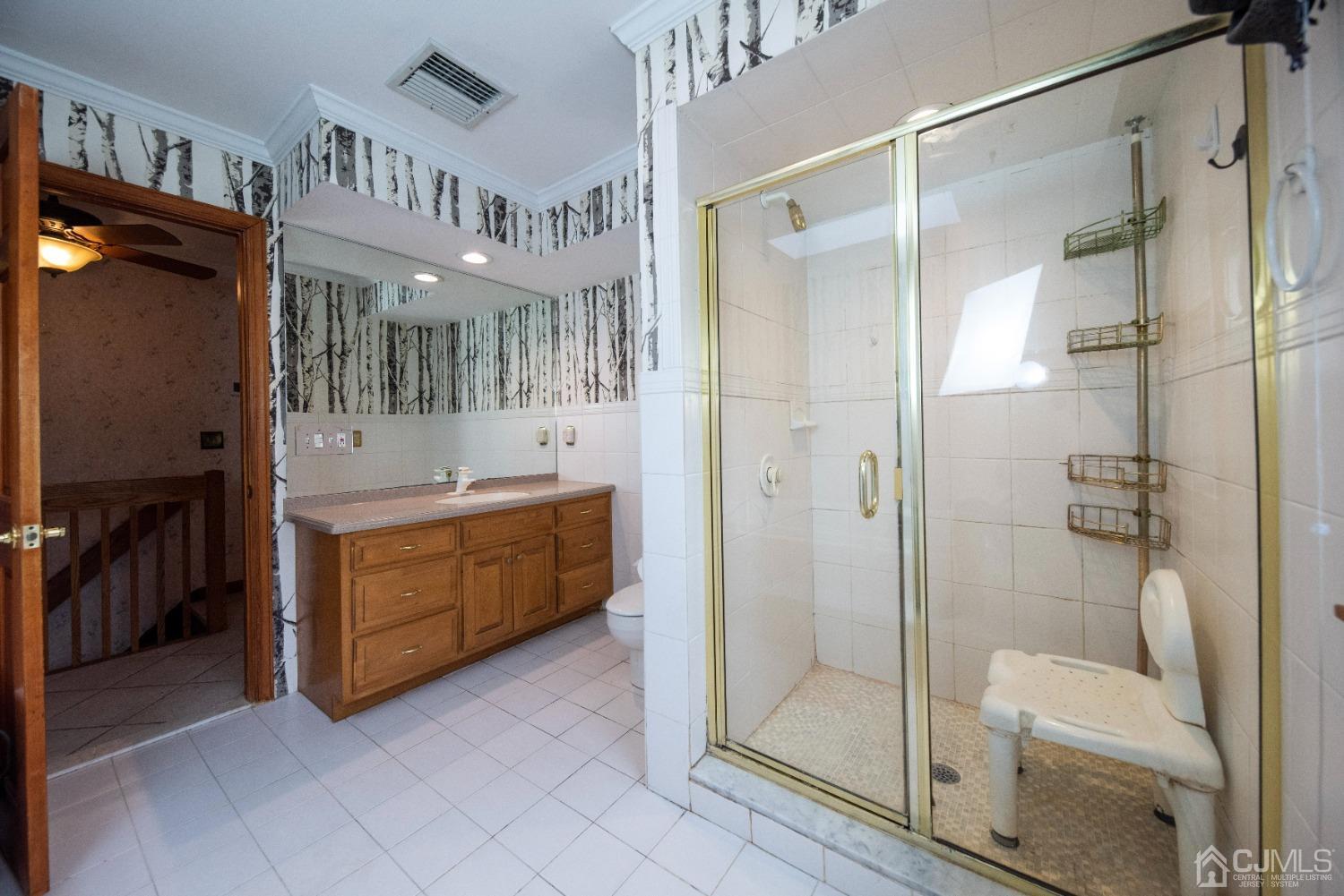 115 New Brooklyn Road Edison, NJ 08817 - Photo 36 of 53 a bathroom with a double vanity sink and a mirror