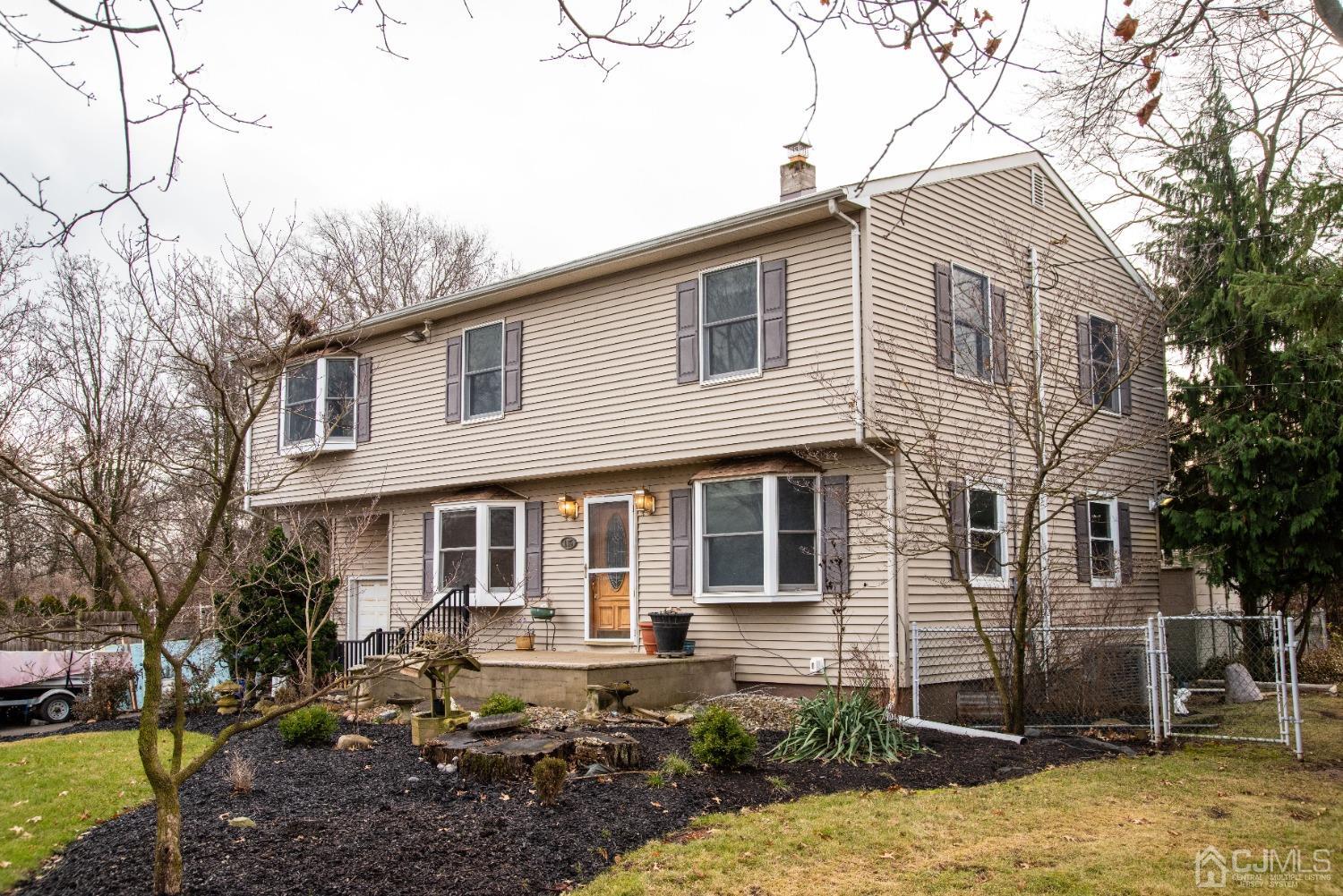 115 New Brooklyn Road Edison, NJ 08817 - Photo 4 of 53 a front view of a house with garden
