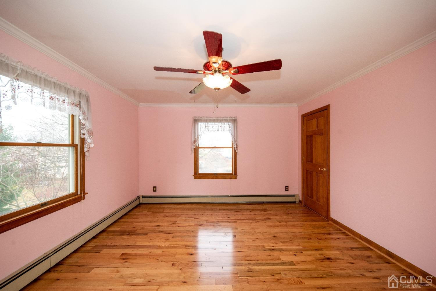 115 New Brooklyn Road Edison, NJ 08817 - Photo 42 of 53 a view of an empty room with window and a chandelier fan