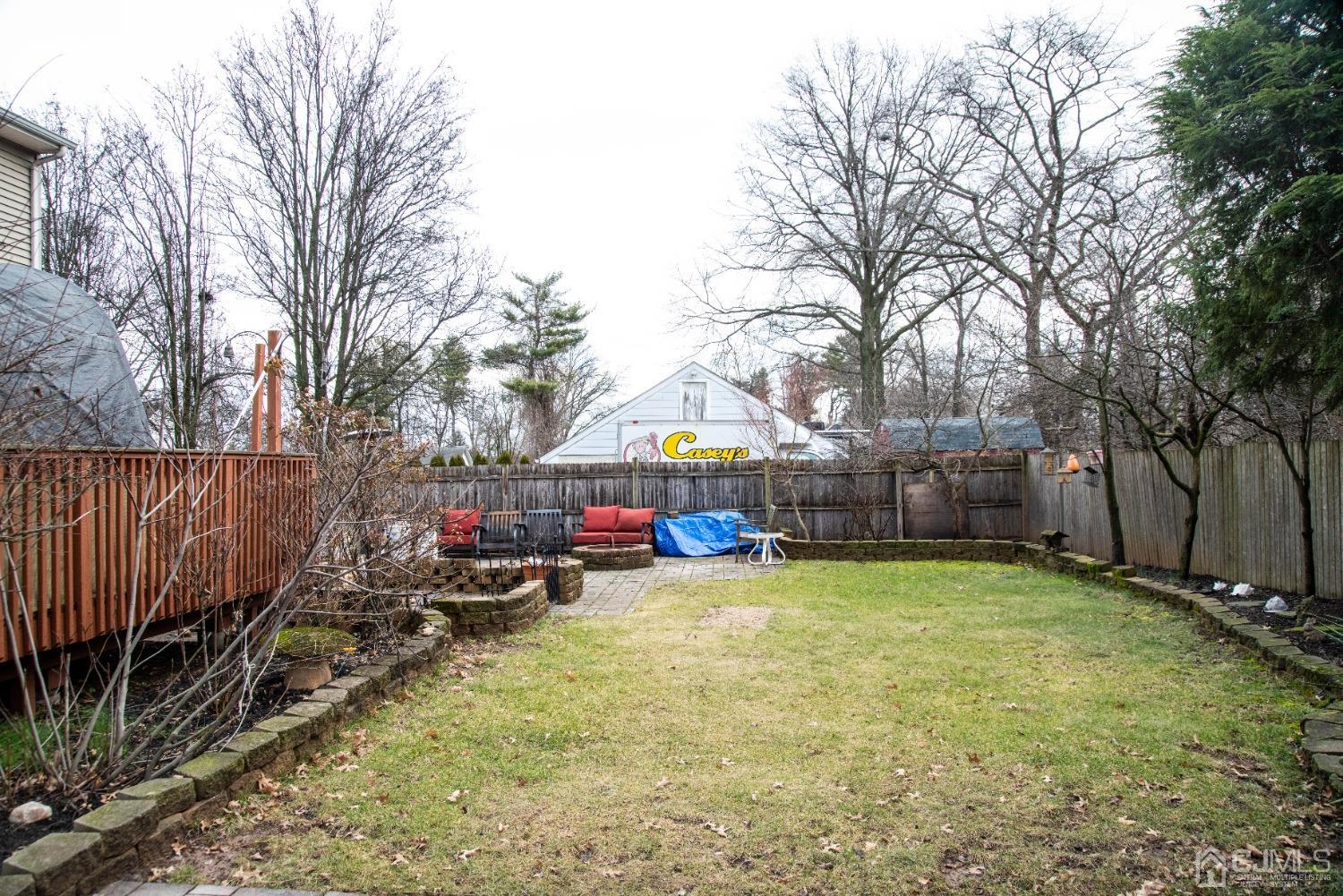 115 New Brooklyn Road Edison, NJ 08817 - Photo 48 of 53 a view of a park with large trees and a wooden fence