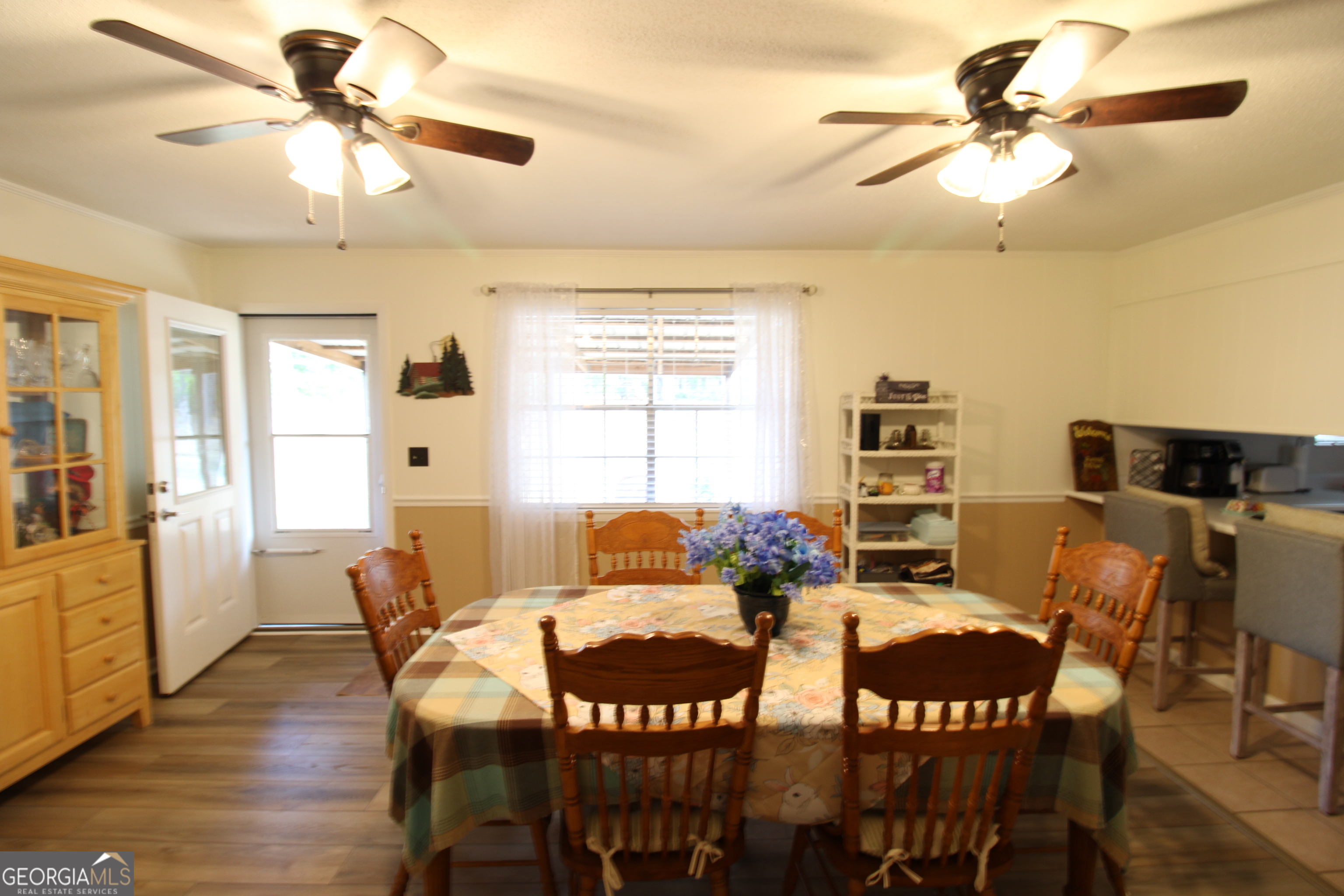 2337 Spring Street Waycross, GA 31503 - Photo 15 of 28 a view of a dining room with furniture and wooden floor