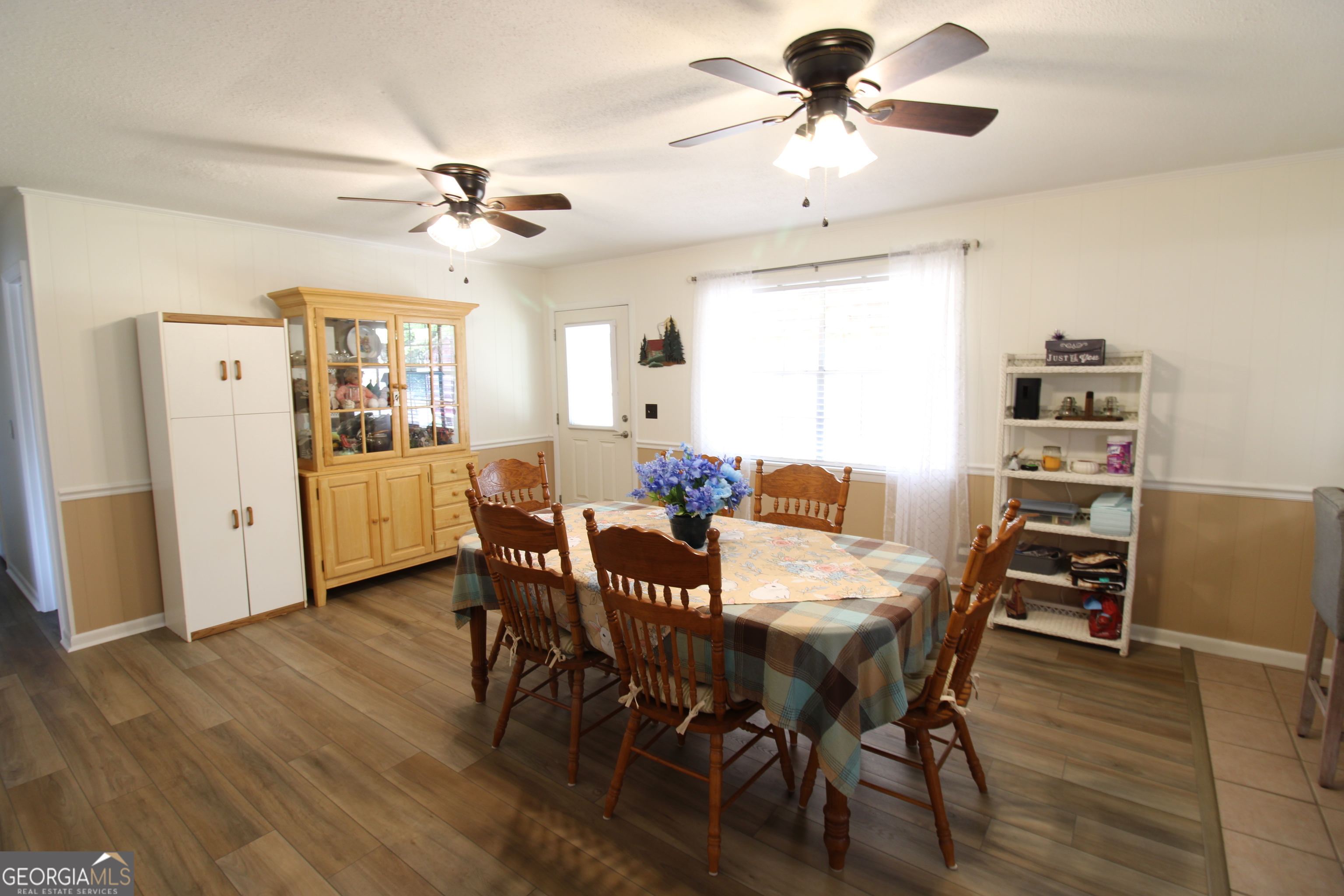 2337 Spring Street Waycross, GA 31503 - Photo 17 of 28 a view of a dining room with furniture and wooden floor