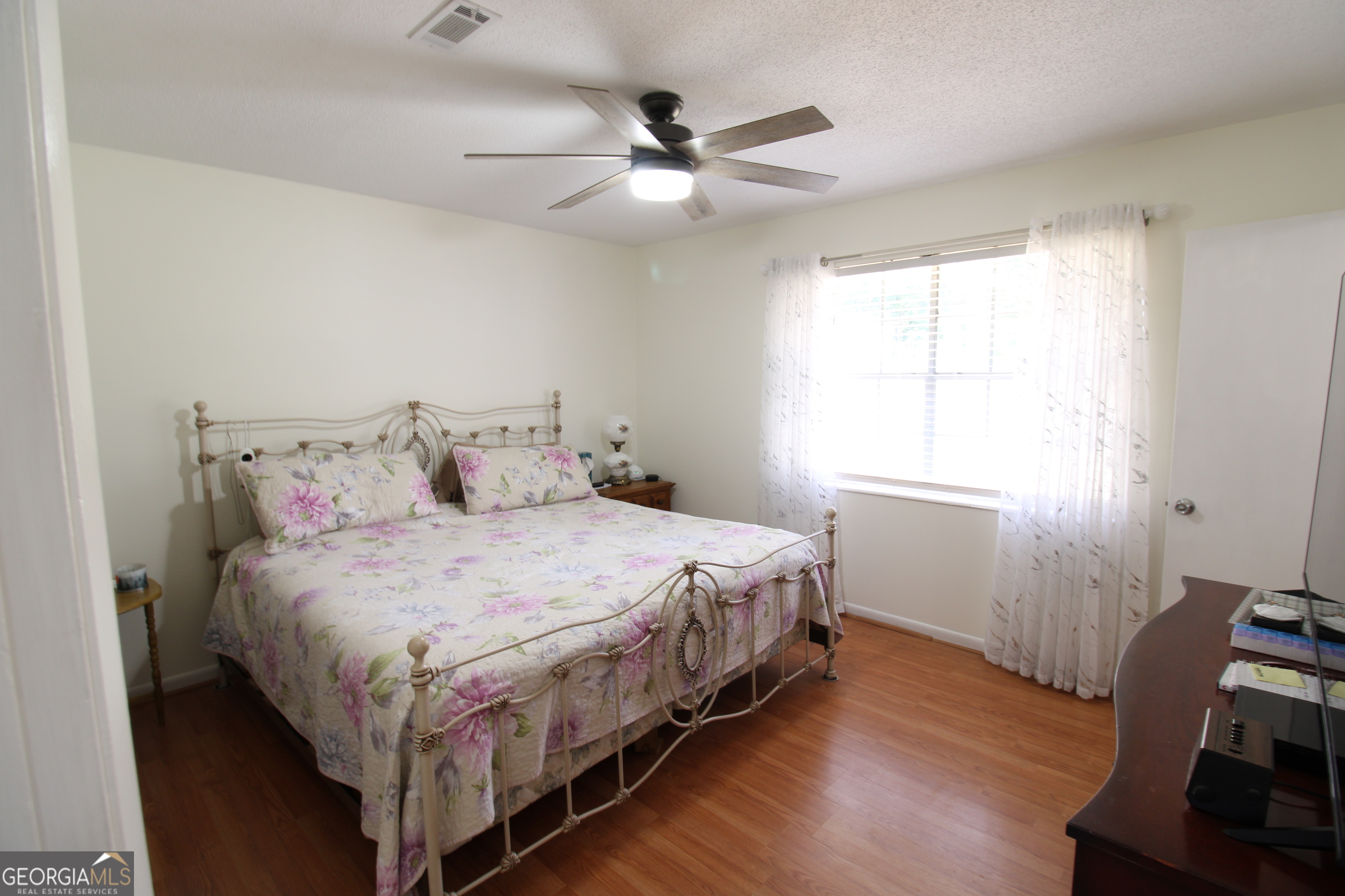2337 Spring Street Waycross, GA 31503 - Photo 20 of 28 a bedroom with a bed and a window