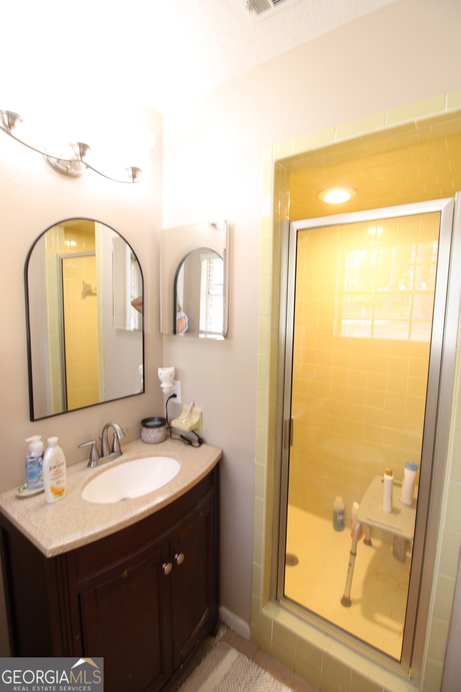 2337 Spring Street Waycross, GA 31503 - Photo 23 of 28 a bathroom with a sink and a mirror