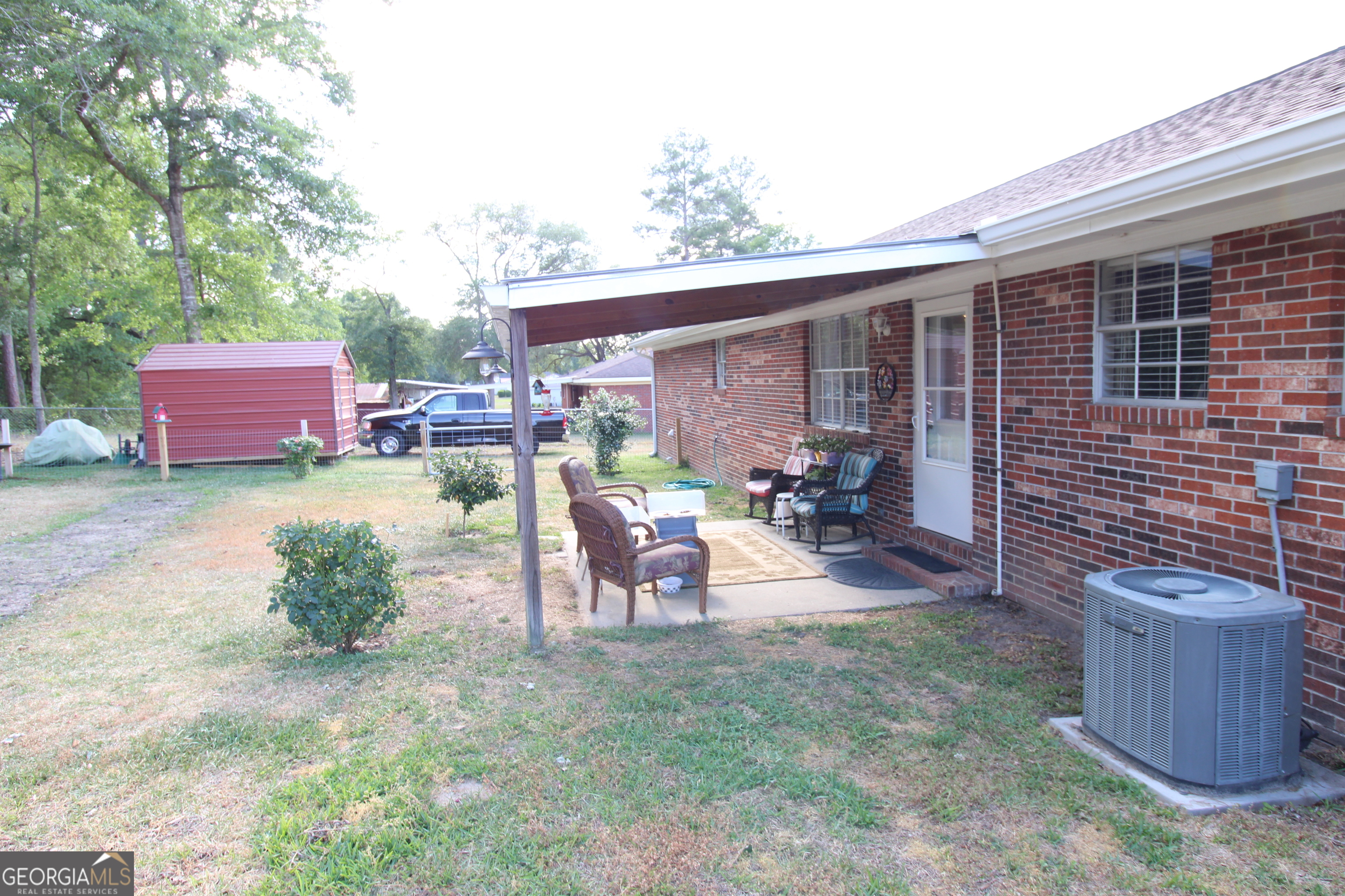 2337 Spring Street Waycross, GA 31503 - Photo 6 of 28 a view of a chairs and table in patio