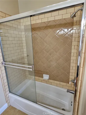 a bathroom with a shower and a bathtub
