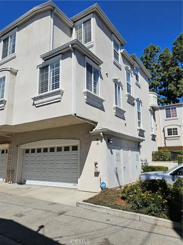 a front view of a house with a garage