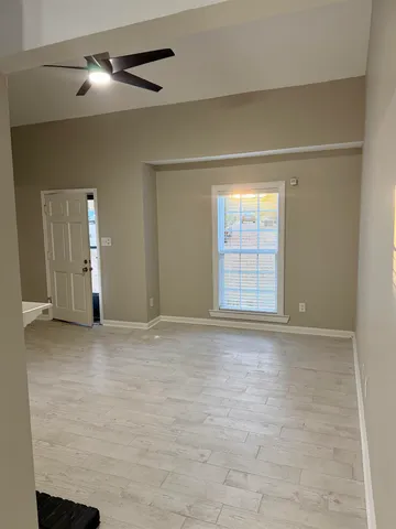 a view of an empty room with a window