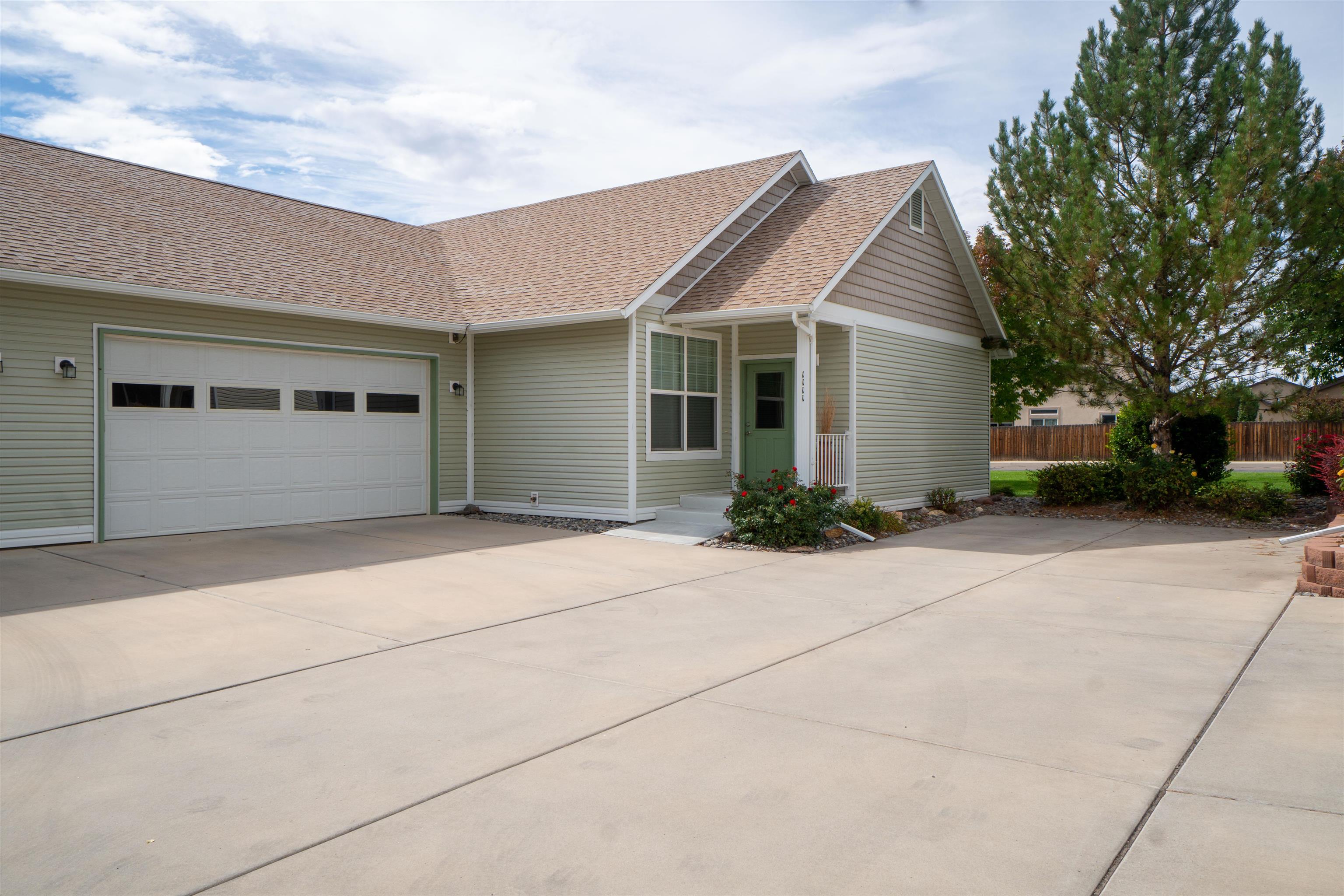 1111 Daisy Lane, Unit 32 Fruita, CO 81521 - Photo 2 of 23 a view of house with outdoor space and parking space