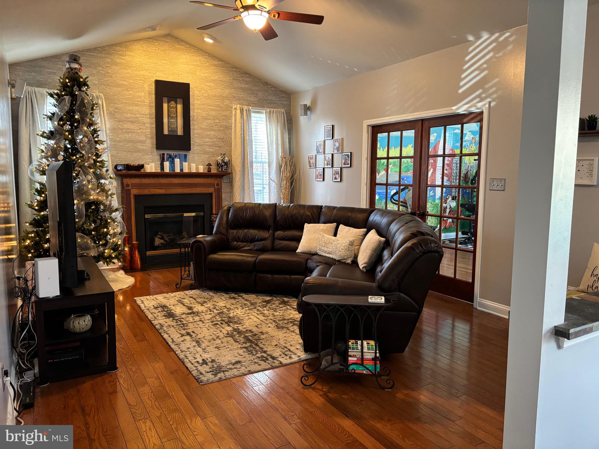 133 Steelton Road Sicklerville, NJ 08081 - Photo 11 of 35 a living room with furniture and a fireplace