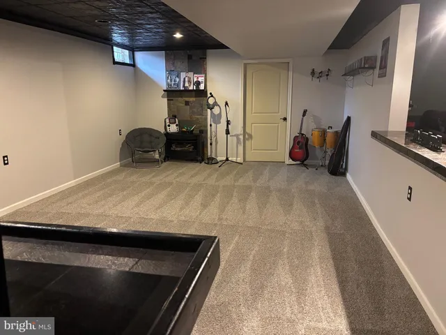 a bedroom with a bed and closet with mirror