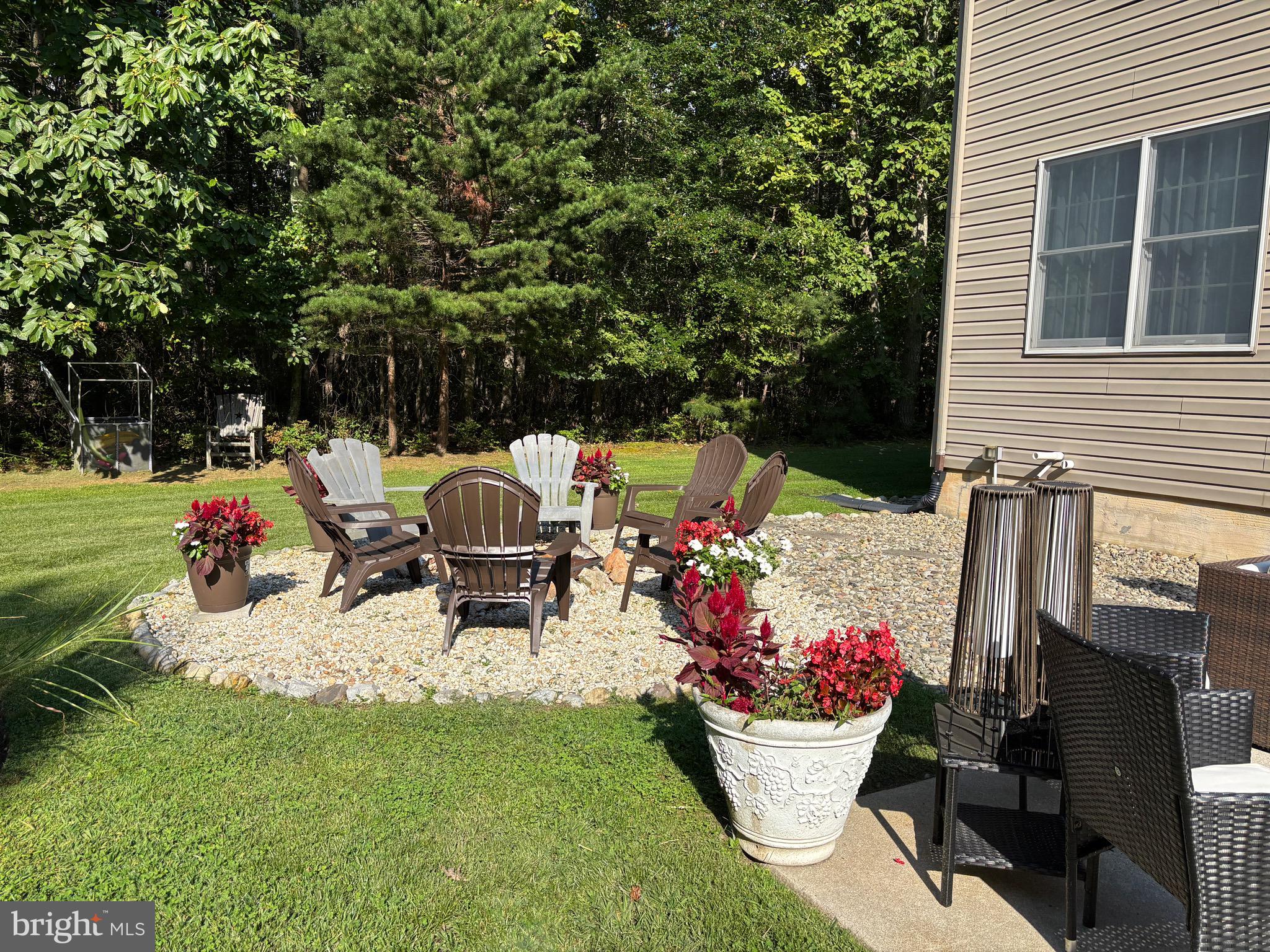 133 Steelton Road Sicklerville, NJ 08081 - Photo 31 of 35 a view of a chairs and table in backyard of the house