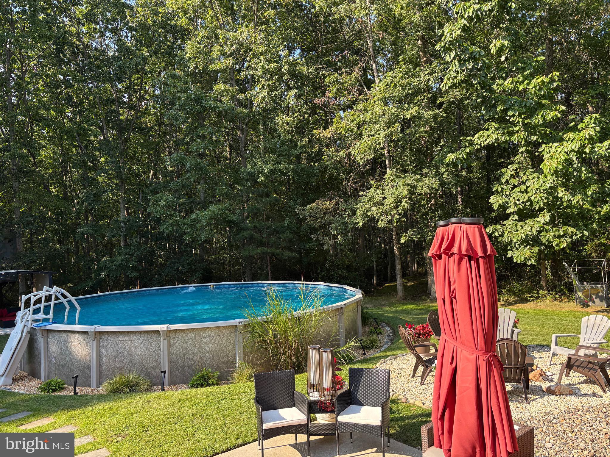 133 Steelton Road Sicklerville, NJ 08081 - Photo 33 of 35 a view of backyard with swimming pool and outdoor seating