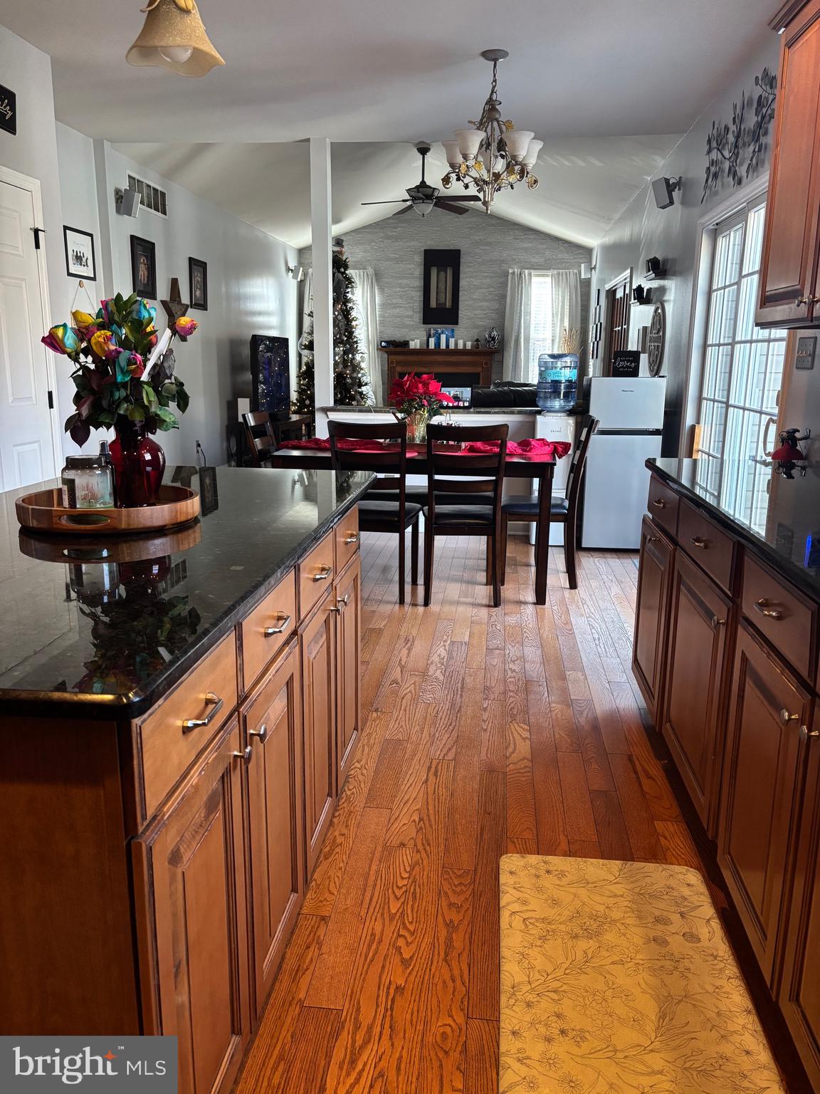 133 Steelton Road Sicklerville, NJ 08081 - Photo 9 of 35 a kitchen with stainless steel appliances a dining table wooden floor and a chandelier