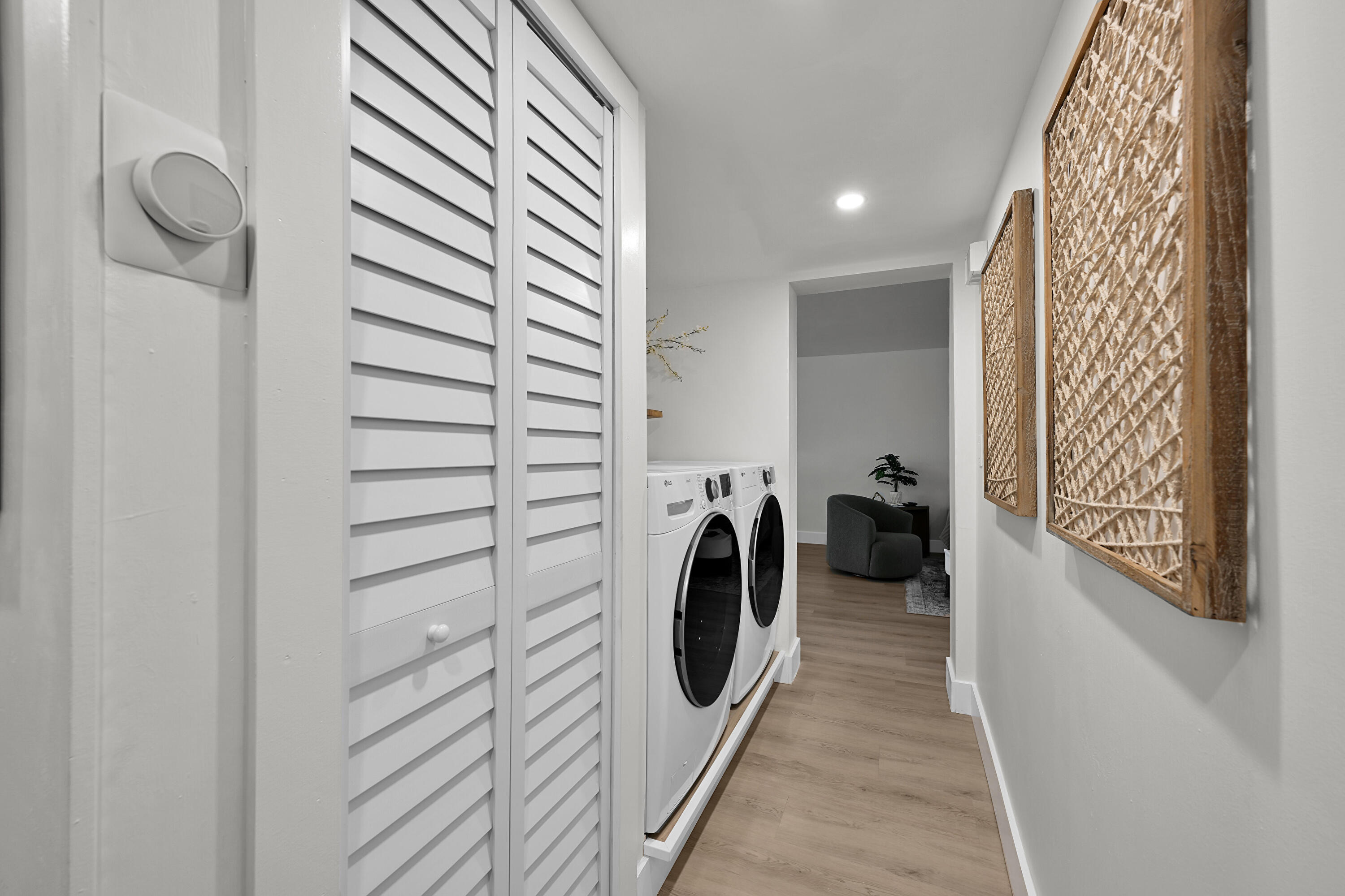 800 East Camino Real, Unit 204 Boca Raton, FL 33432 - Photo 14 of 39 a view of a hallway with washer and dryer