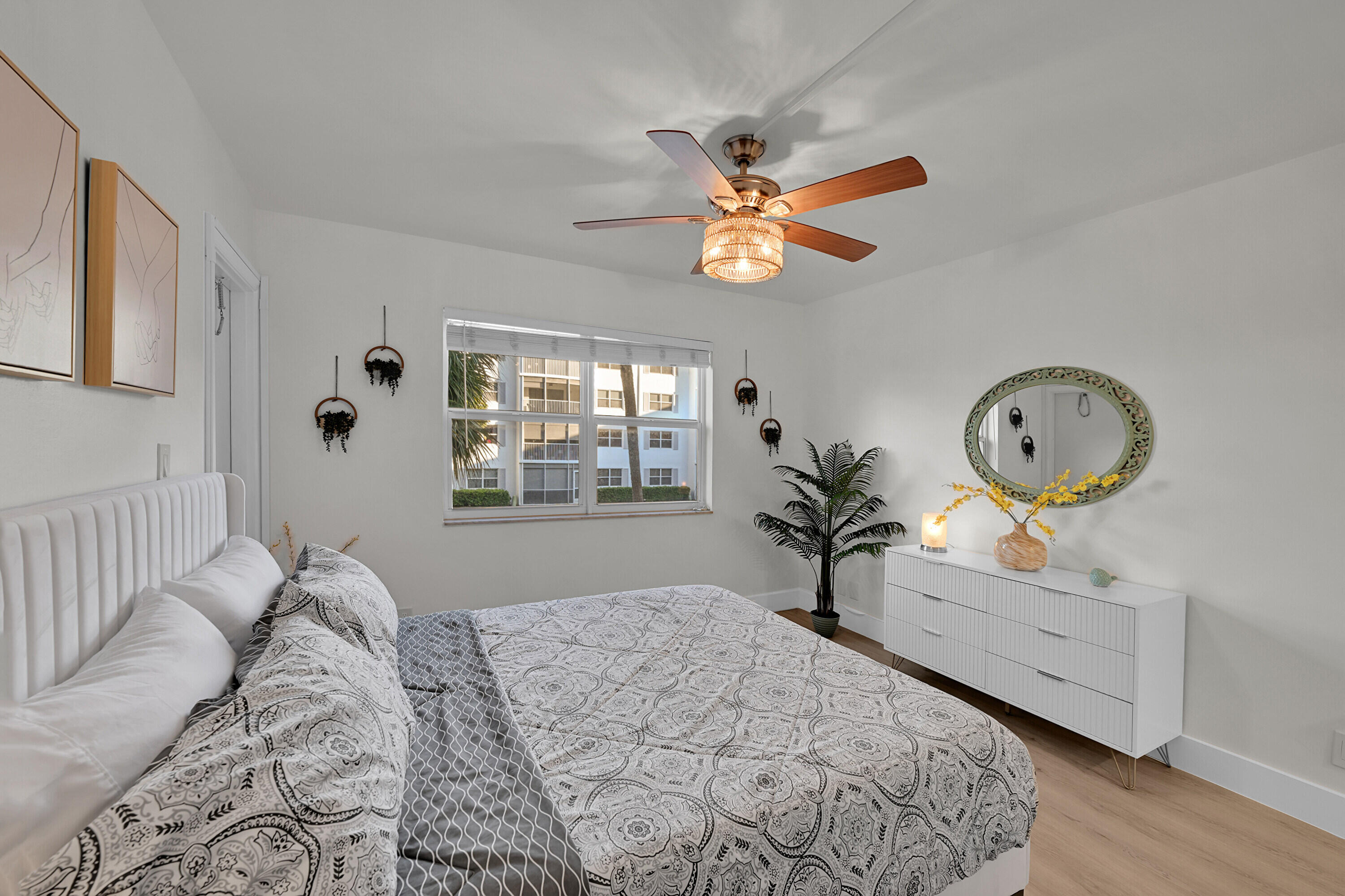 800 East Camino Real, Unit 204 Boca Raton, FL 33432 - Photo 16 of 39 a bedroom with bed and a window