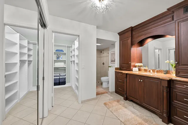 a spacious bathroom with a double vanity sink and a mirror