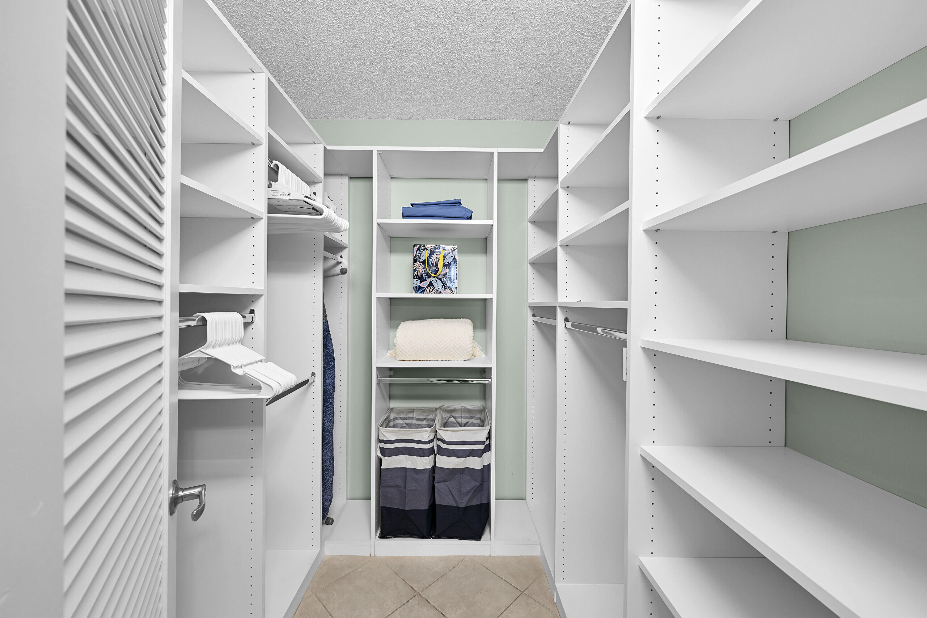 800 East Camino Real, Unit 204 Boca Raton, FL 33432 - Photo 23 of 39 a view of walk in closet with empty racks