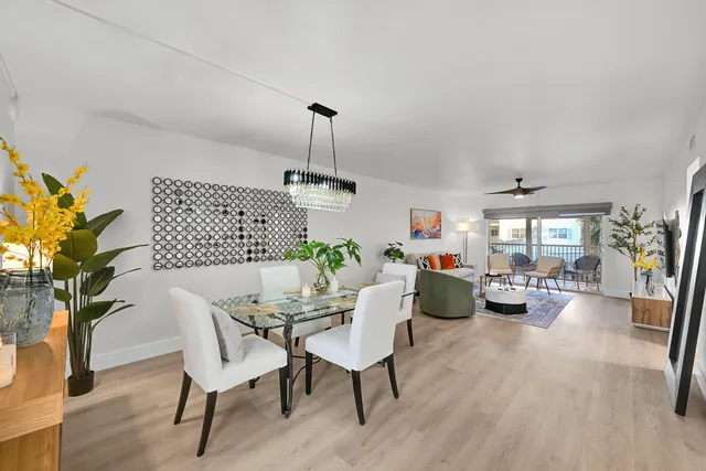 a view of a livingroom with furniture window and wooden floor