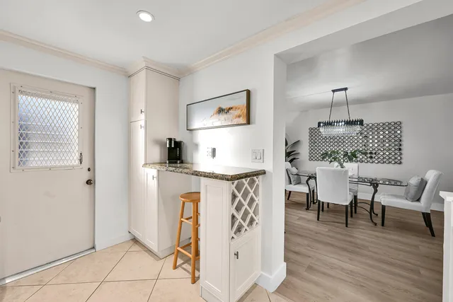 a workspace with furniture window and wooden floor