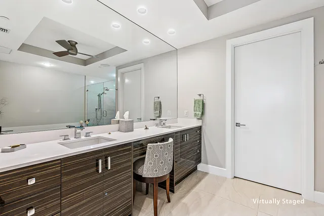 a spacious bathroom with a granite countertop sink a mirror and a