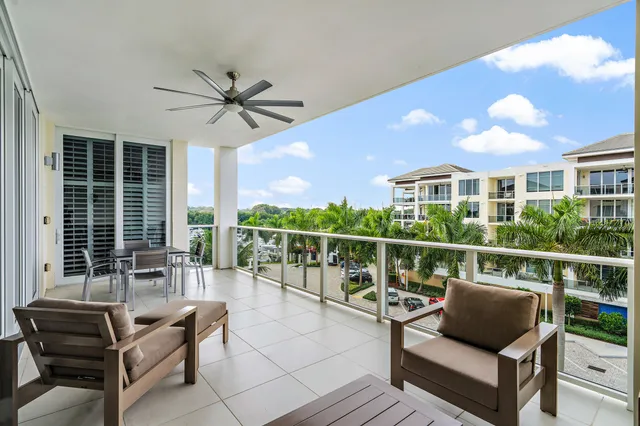 a balcony with furniture and view of city