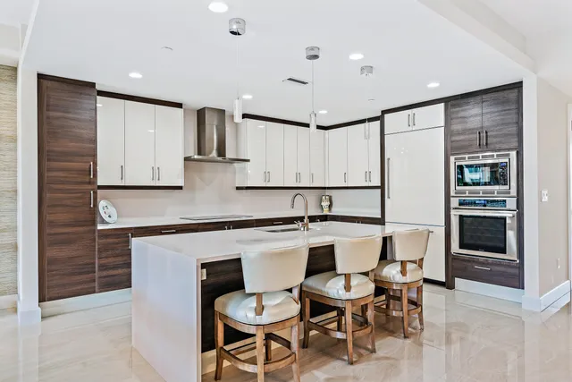 a kitchen with a sink cabinets and window
