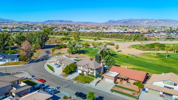 a white toilet sitting next to a shower