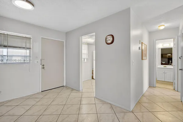a view of a hallway with a bathroom