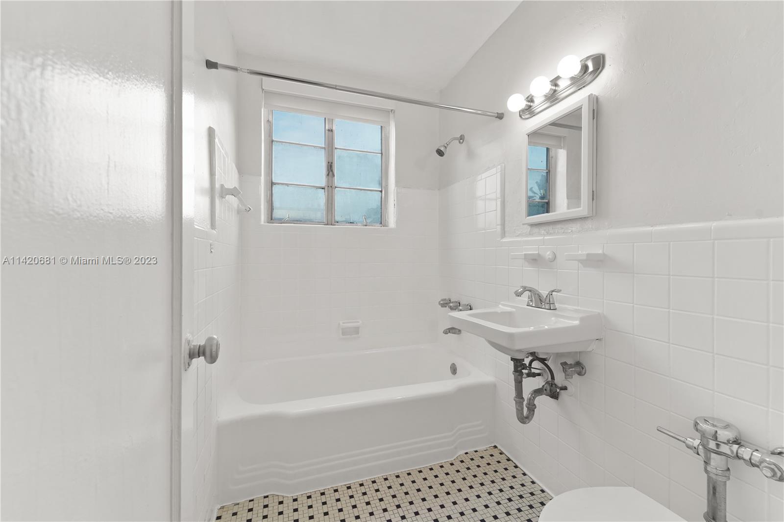 531 16th Street Miami Beach, FL 33139 - Photo 24 of 26 a bathroom with a sink toilet and shower