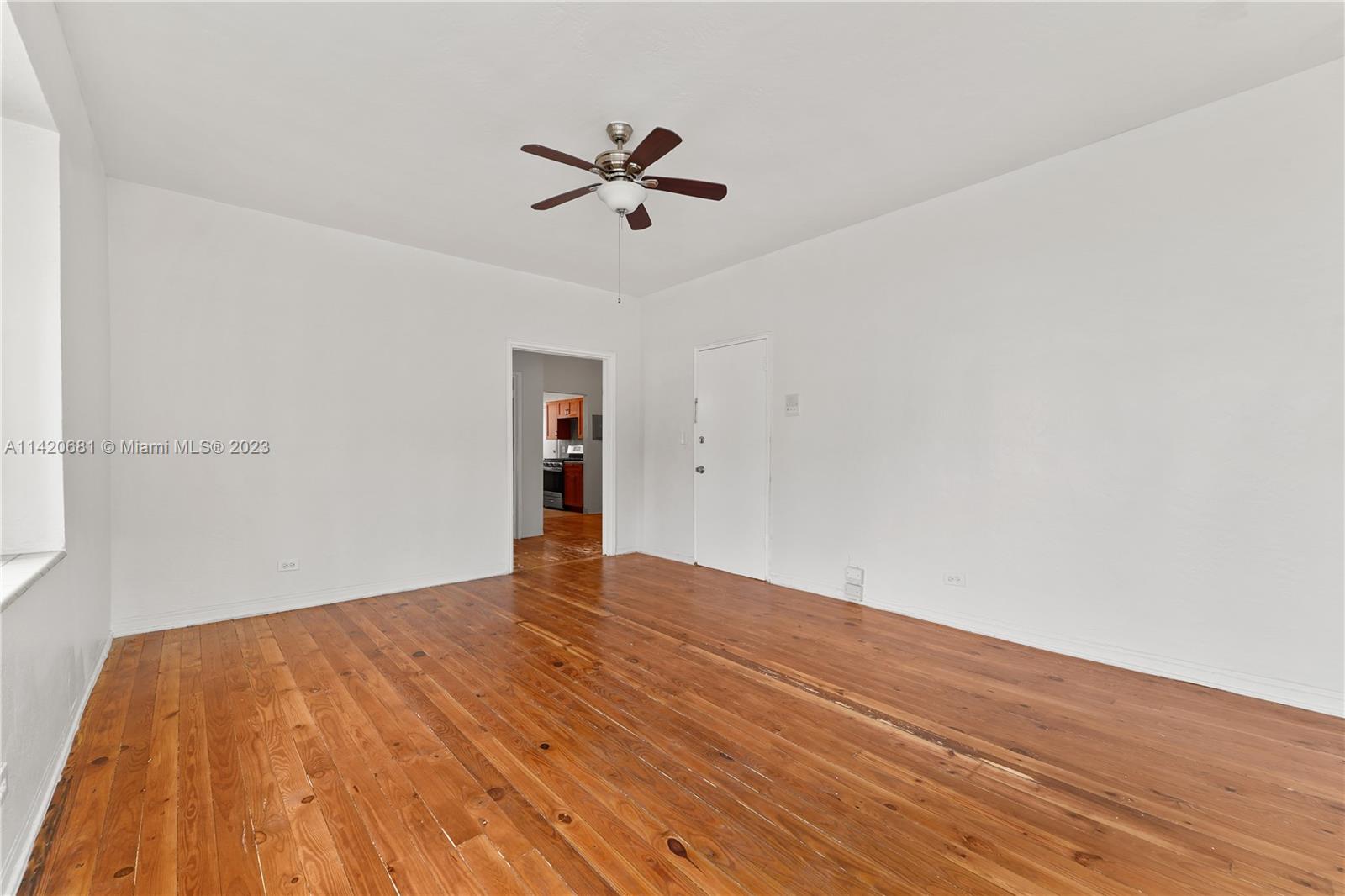 531 16th Street Miami Beach, FL 33139 - Photo 25 of 26 a view of empty room with wooden floor and ceiling fan