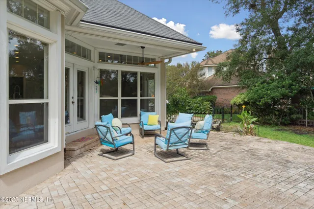 a view of a dining room with furniture wooden floor and chandelier