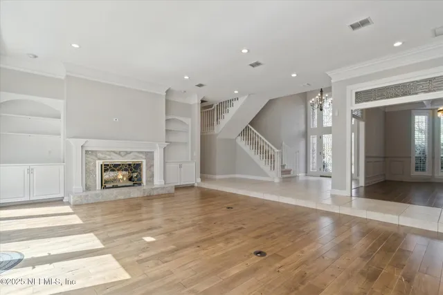 a bathroom with a granite countertop sink and a large mirror