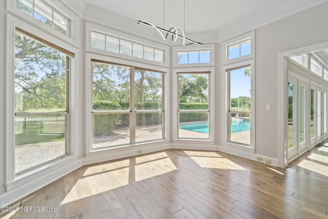 a living room with furniture a couch and a flat screen tv