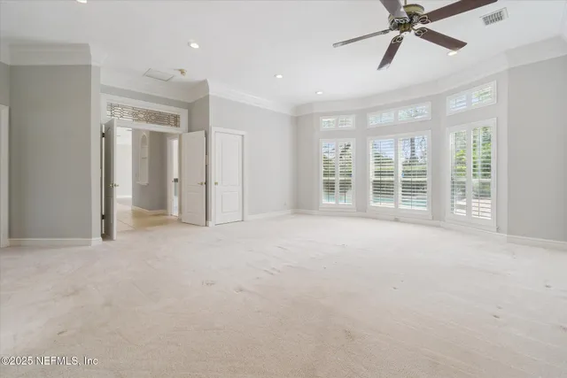 a bed room with a bed and a night stand