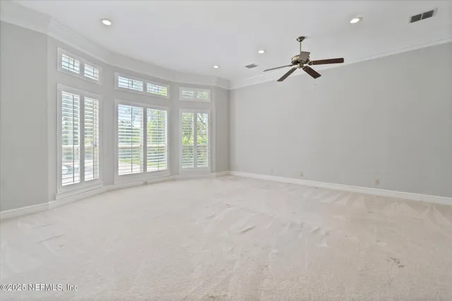 a bathroom with a double vanity sink toilet and a mirror