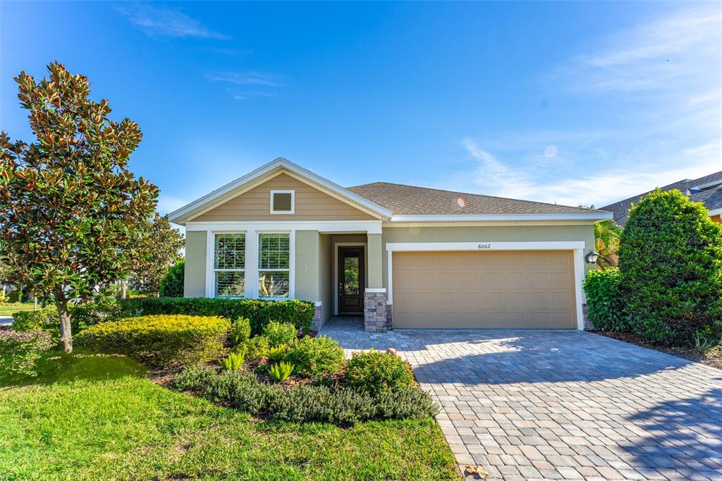 6002 Thrushwood Road Lithia, FL 33547 - Photo 1 of 1 Lovely Stacked Stone Elevation & Lush Landscaping