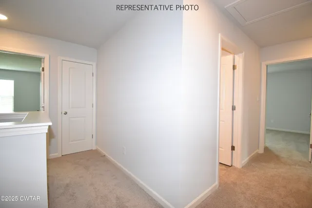 a view of a bathroom with sink mirror and window