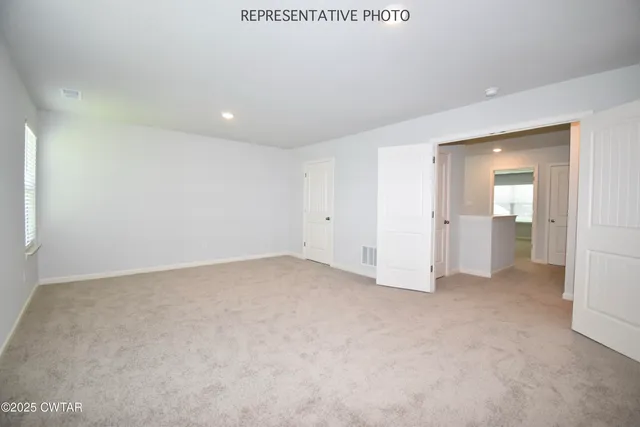 an empty room with a bathroom