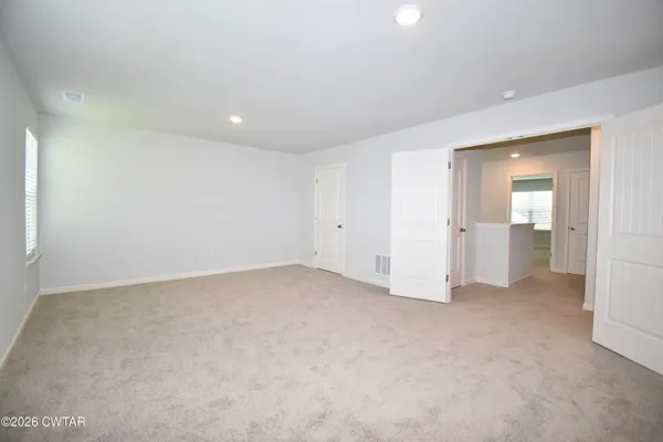 an empty room with a bathroom